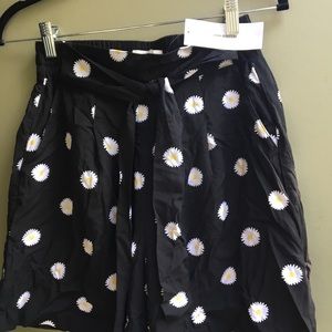 Black Daisy high waisted shorts.